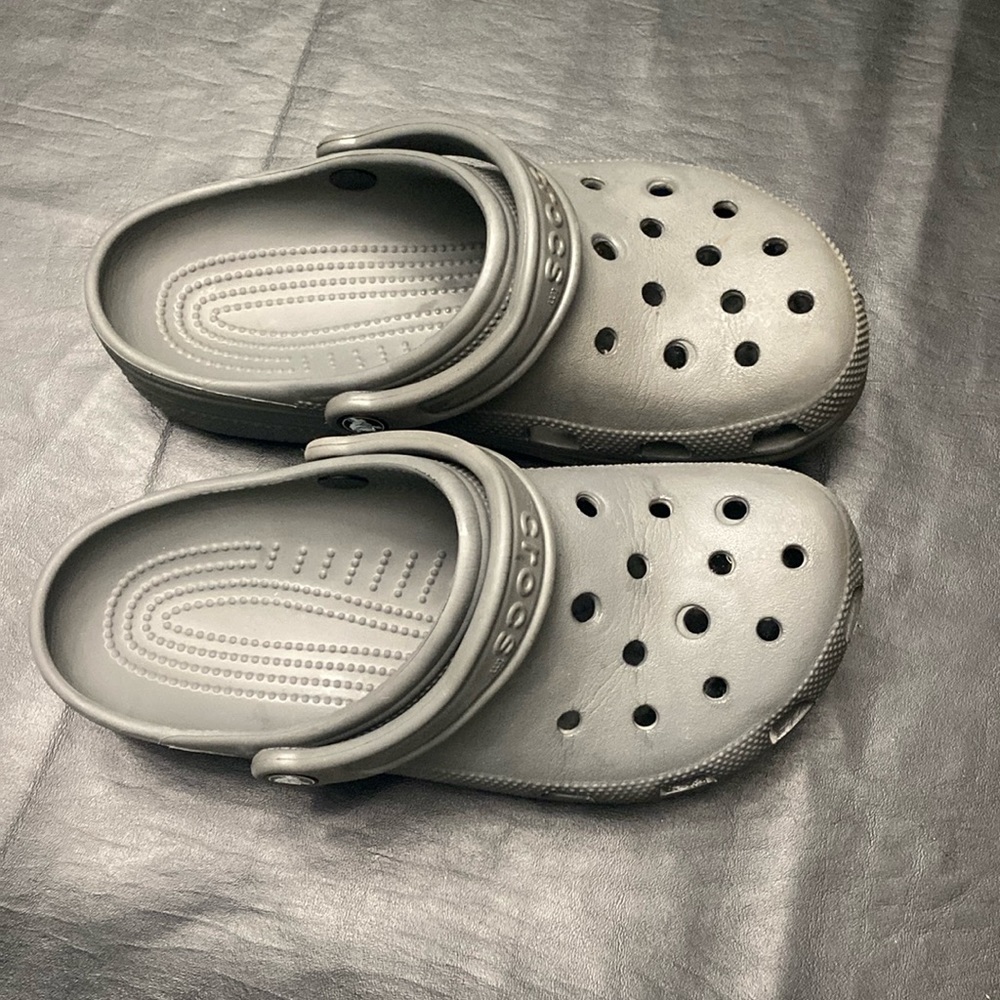 Grey crocs, men 7 women 9